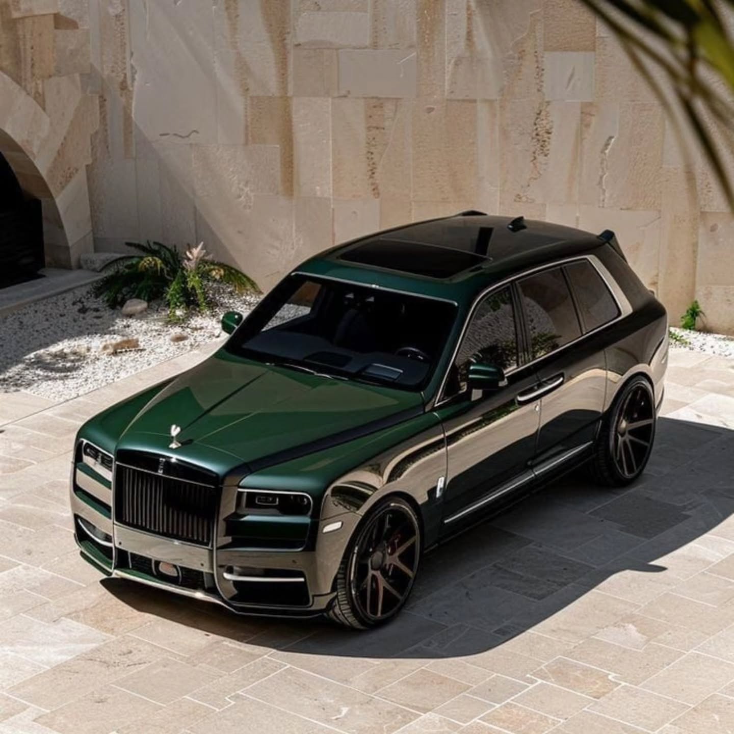 Luxury chauffeur vehicle waiting at a private residence